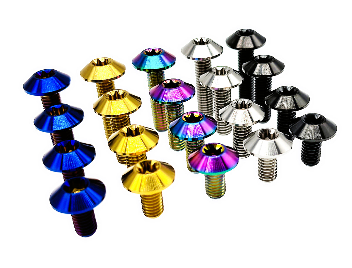 Anodized titanium M6 umbrella head Torx bolts massed in five color groups, angled view