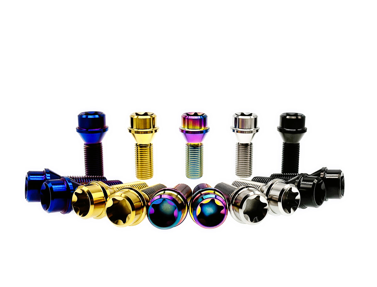 Titanium M12 wheel lug bolts standing and face up with Torx T70 sockets visible
