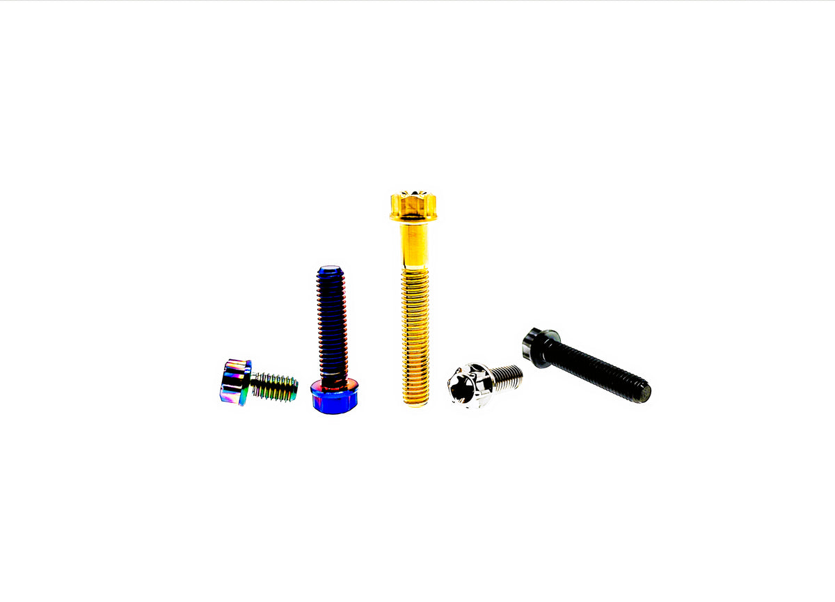 Five titanium M6 CNC flange Torx head bolts, one in each anodized finish