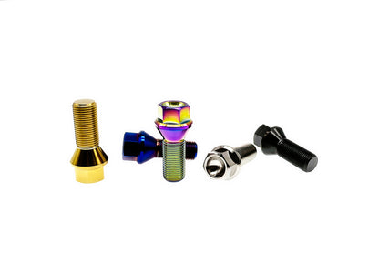Five titanium M14 conical seat lug bolts, one in each anodized finish, scattered